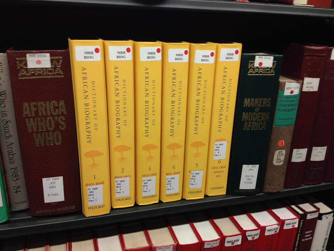 Books on shelves in a library reading room
